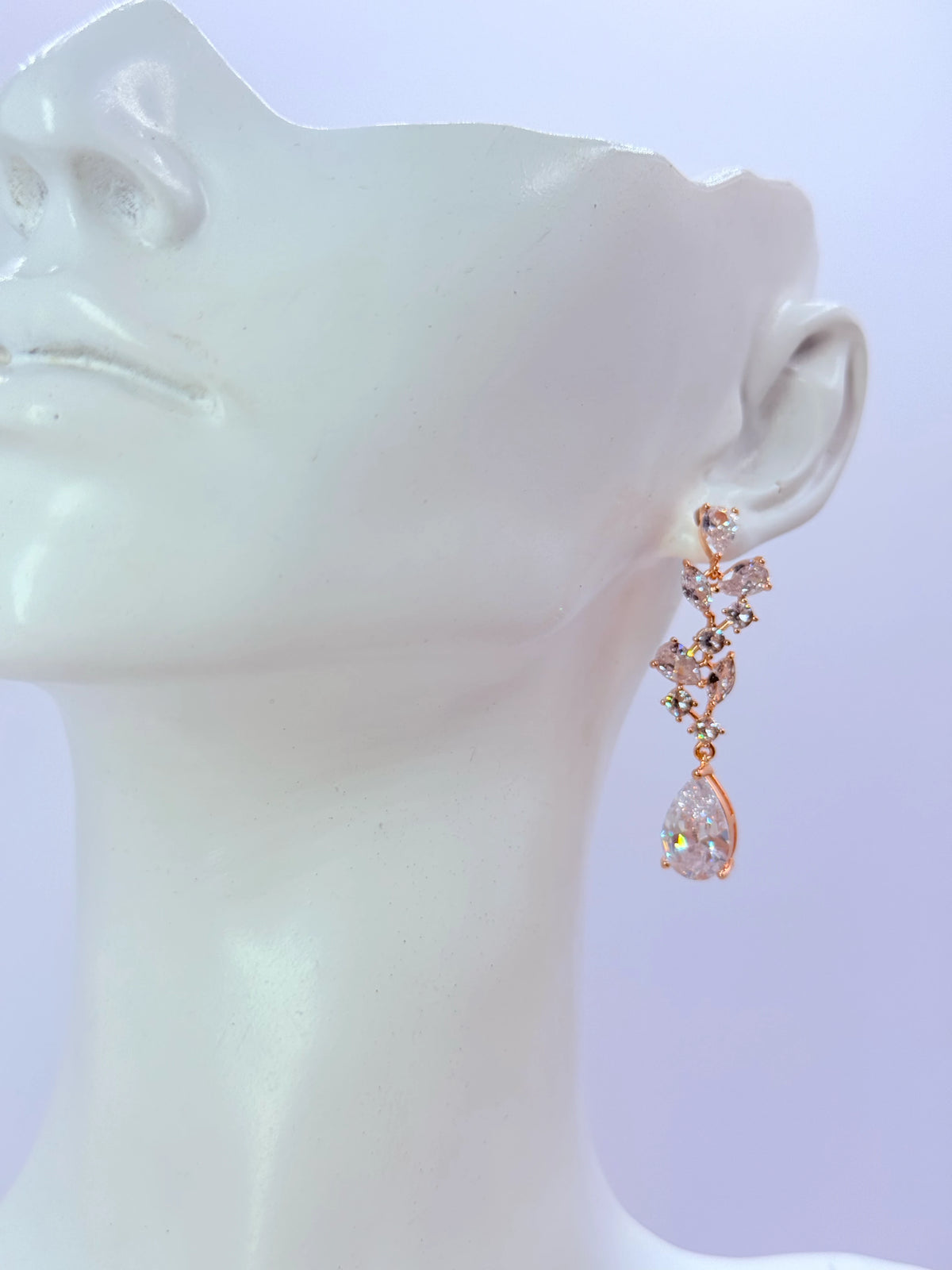 Aros hojas de circones con gota y baño de oro rosa