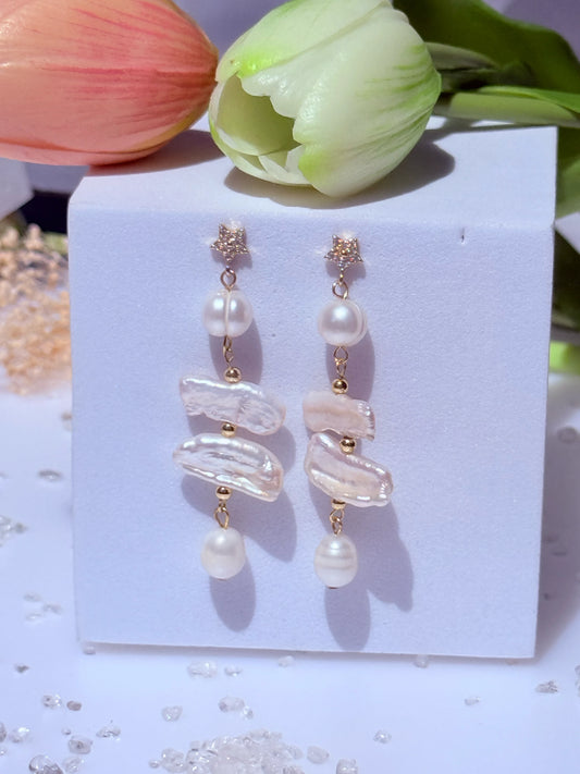 aros largos con perlas barrocas y estrella con circones baño de oro 18k