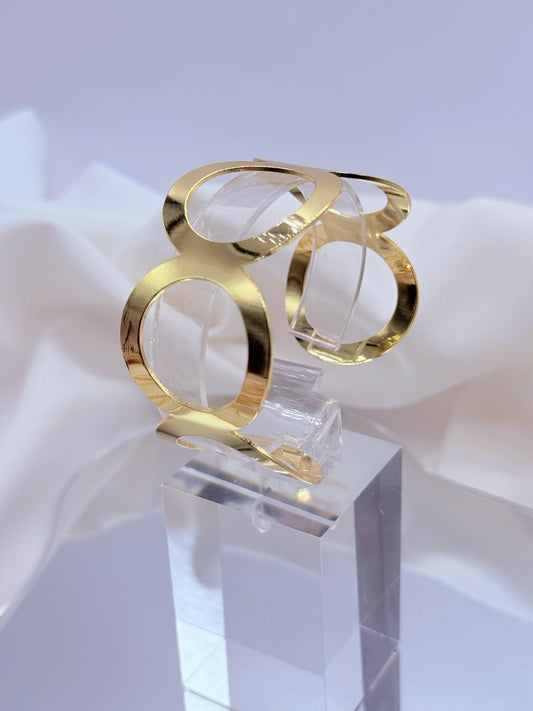Pulsera geométrica bañada en oro 18K con diseño circular contemporáneo