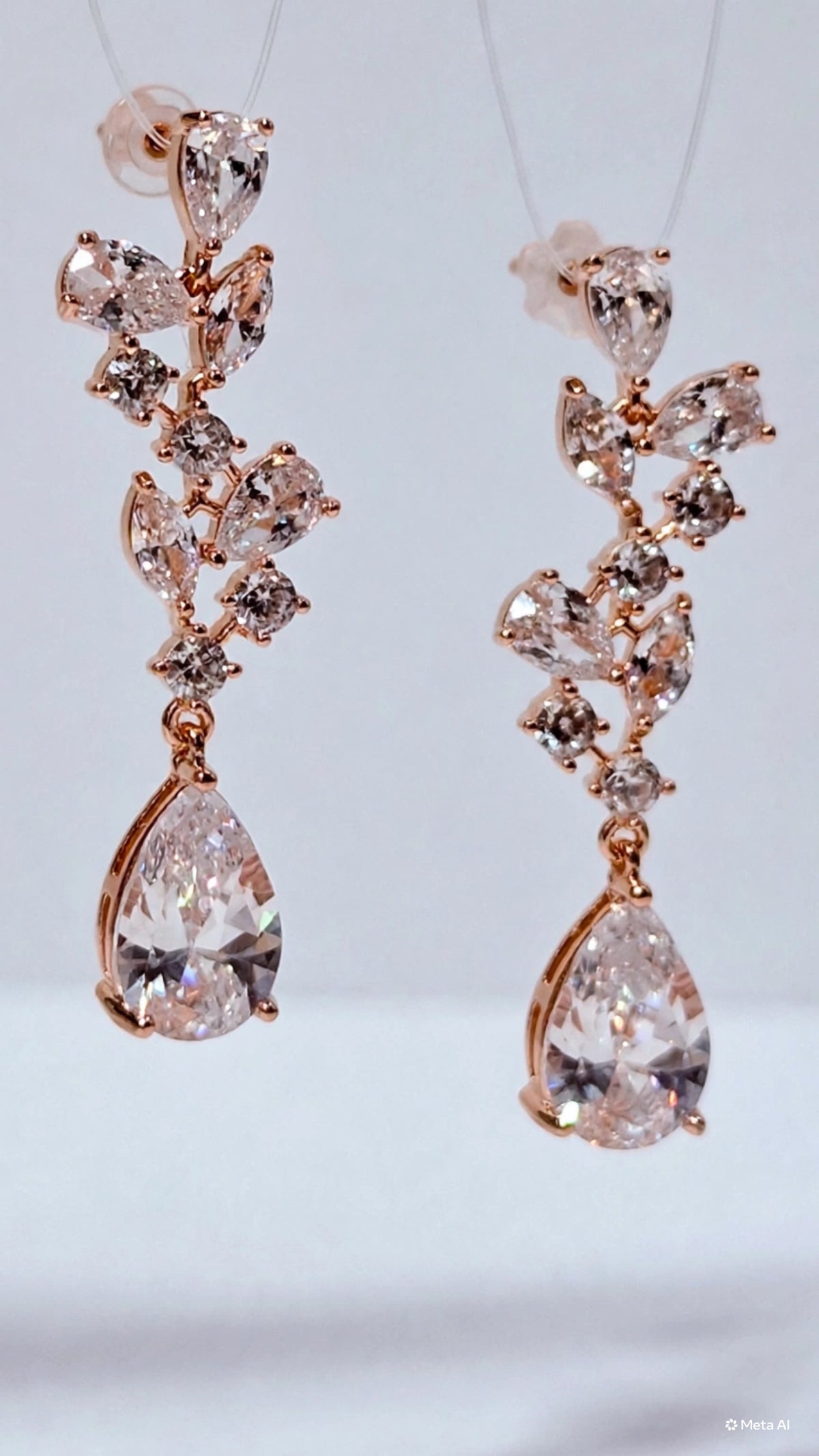 Aros hojas de circones con gota y baño de oro rosa