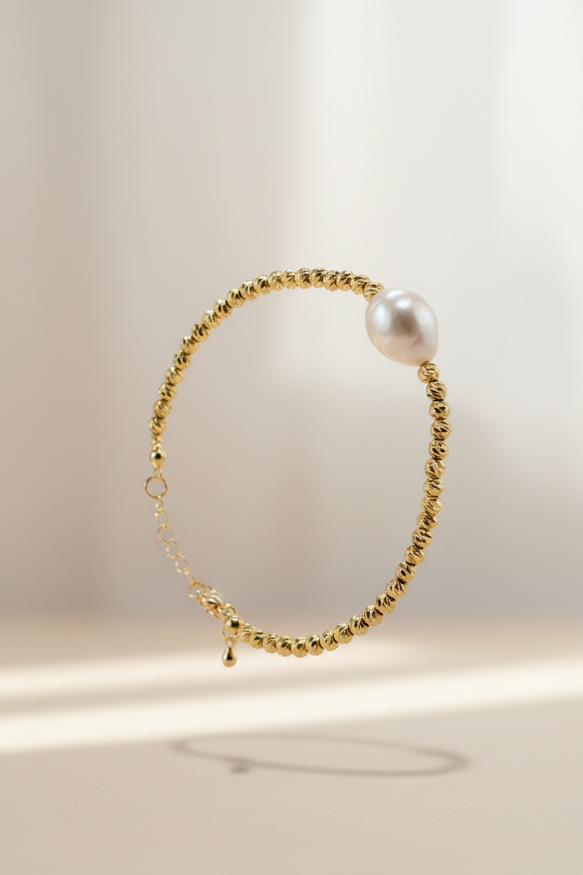 Pulsera de Perla barroca natural y mostacillas bañadas en oro 18K