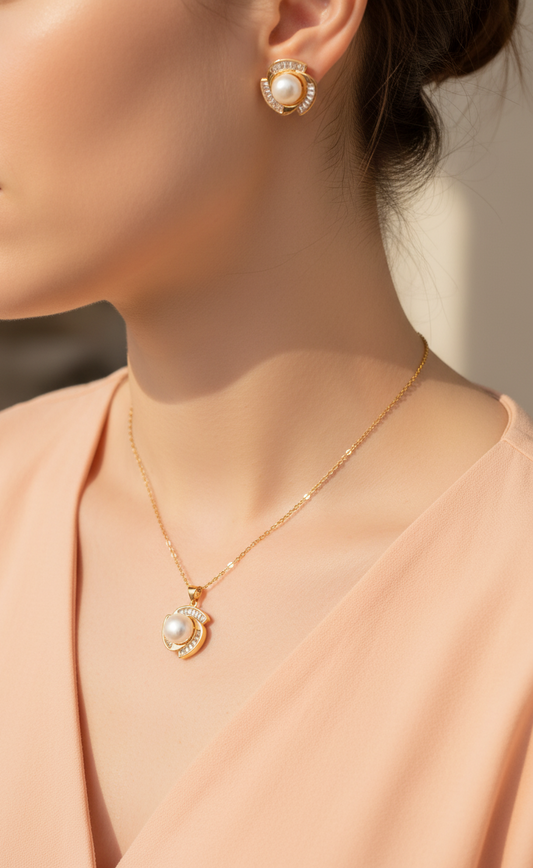 conjunto de joyería con perla natural y circones sobre fondo blanco La Merced Joyas